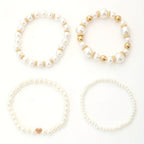 Conjunto de elegantes pulseras en forma de corazón con perlas